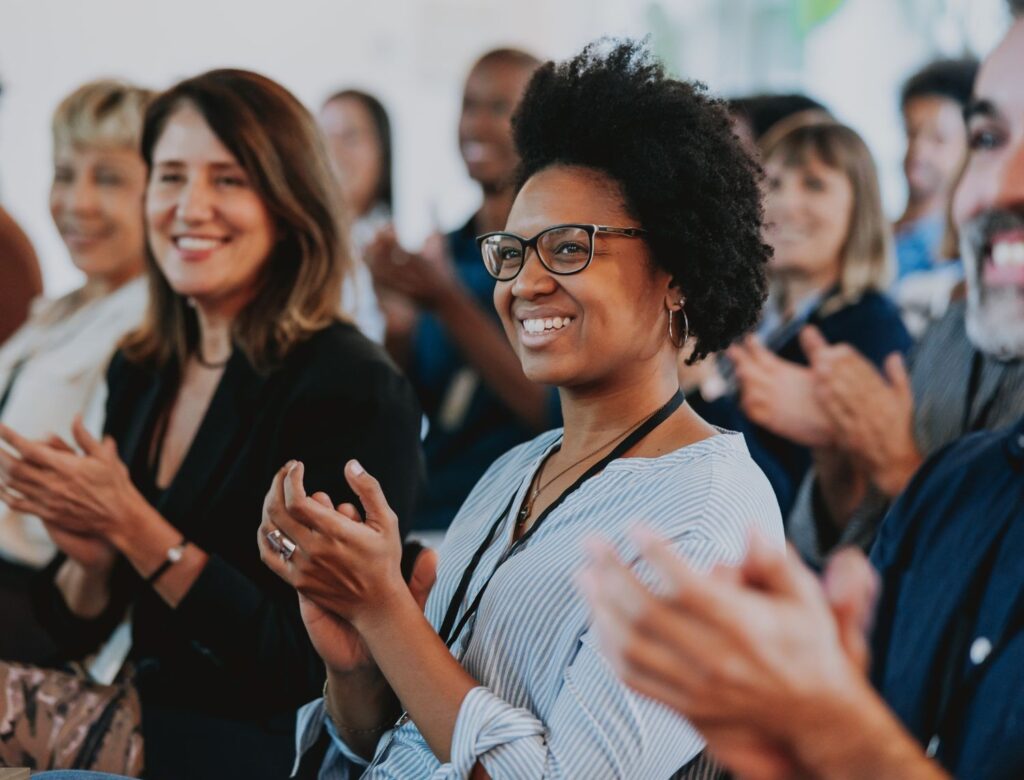 Group of staff clapping